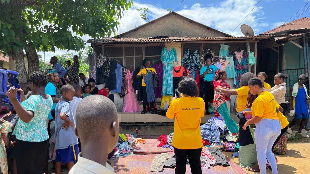 Volunteers distributing support materials during a community outreach in Calabar South