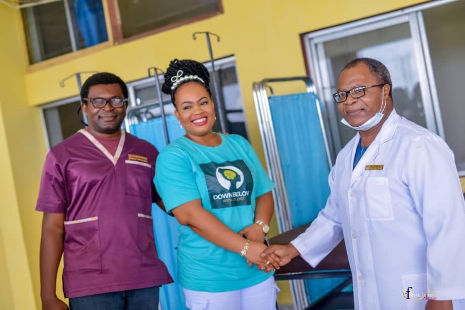 Dr. Didi standing with clinical partners during a hospital bed renewal outreach